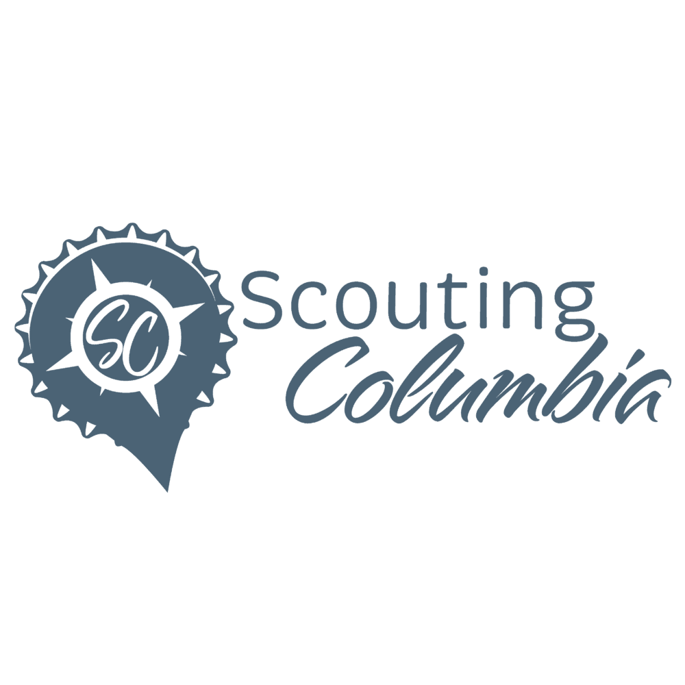 Logo of scouting columbia featuring a pin-shaped design with a ribbon and the letters "sc".